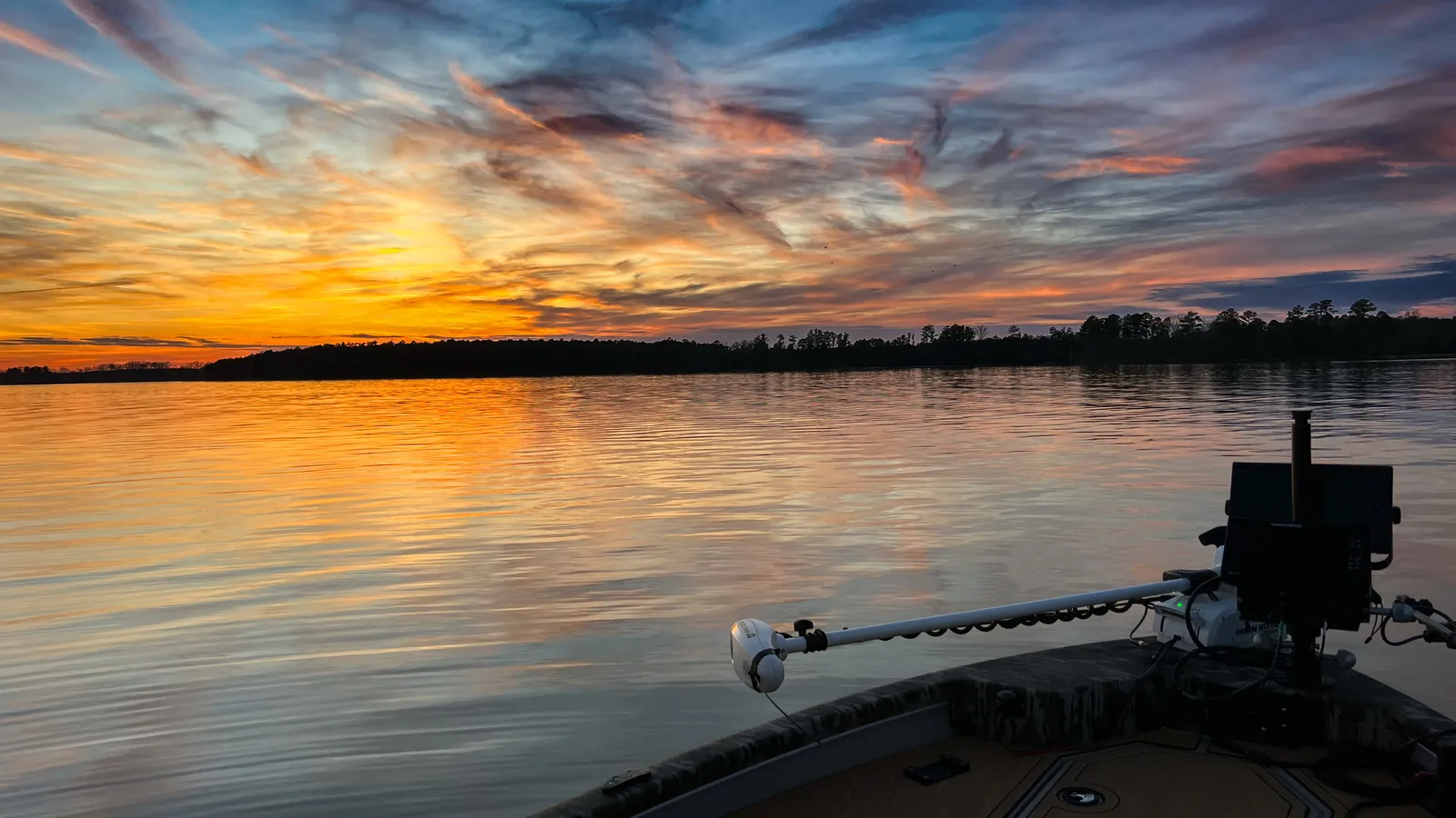 Sunset over an NC lake from the deck of a boat